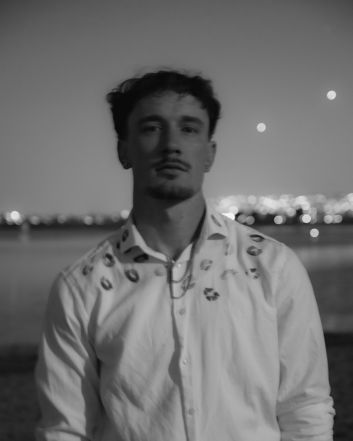 Black-and-white portrait of ProllyRed at night
